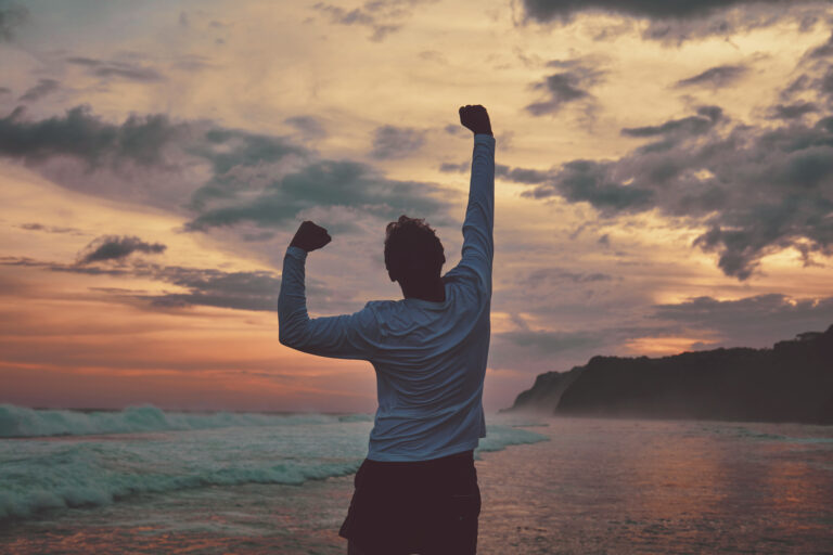 man-standing-on-beach